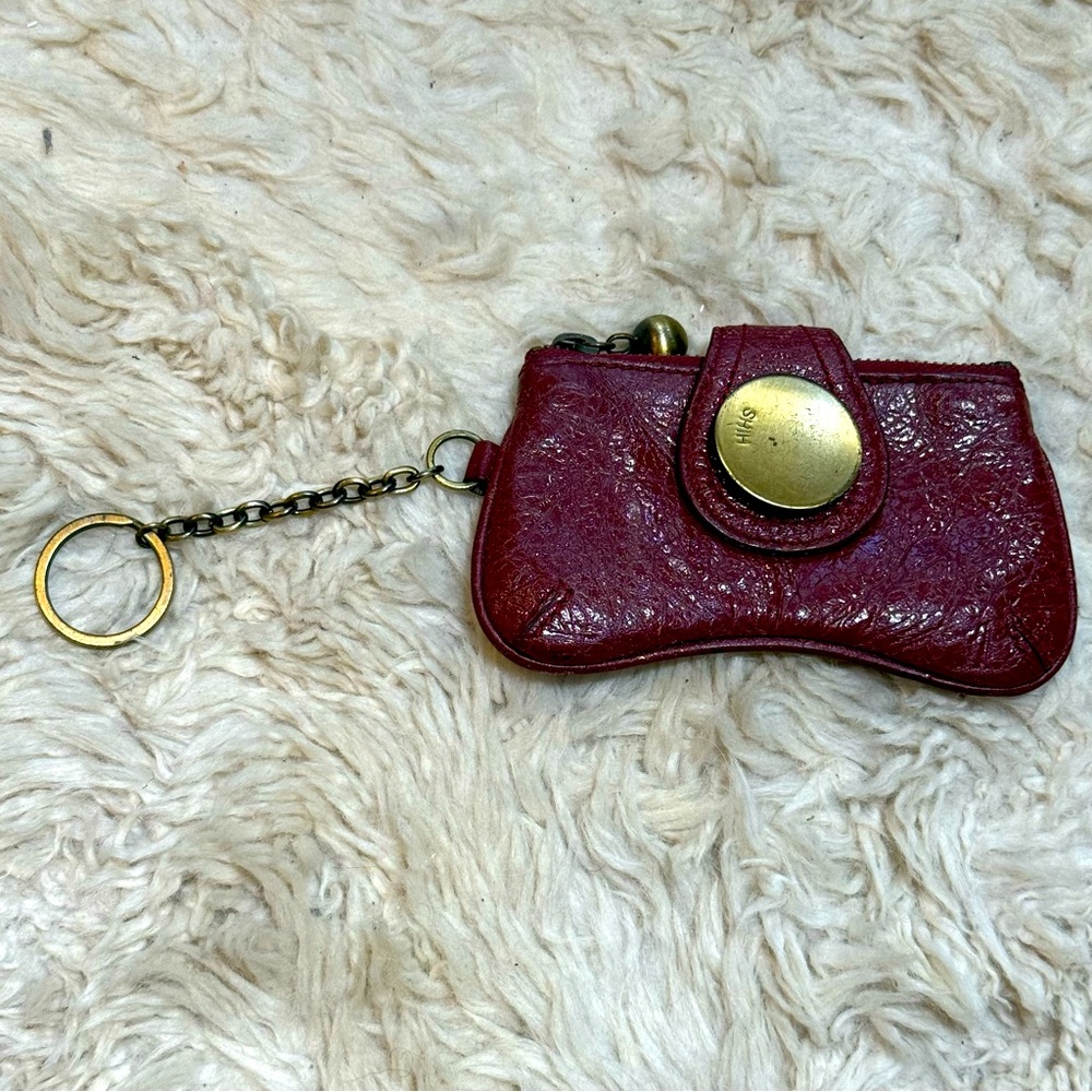 Cracked burgundy, leather coin purse with brushed antique brass hardware